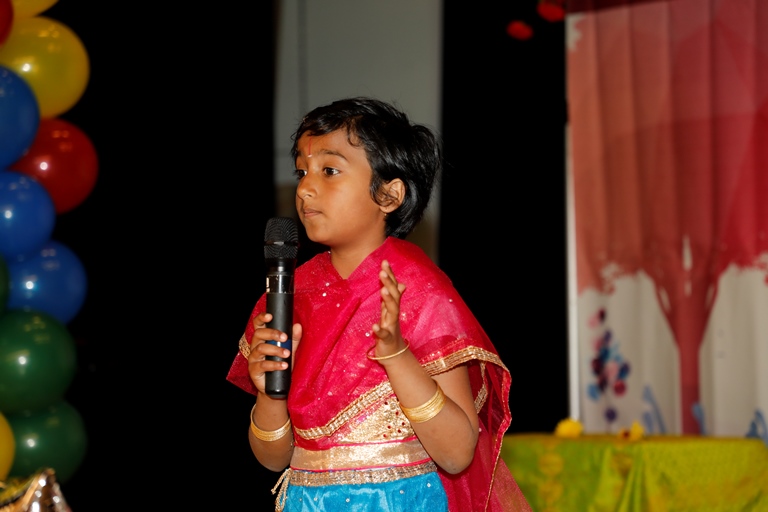 A Prajna student speaking on stage.